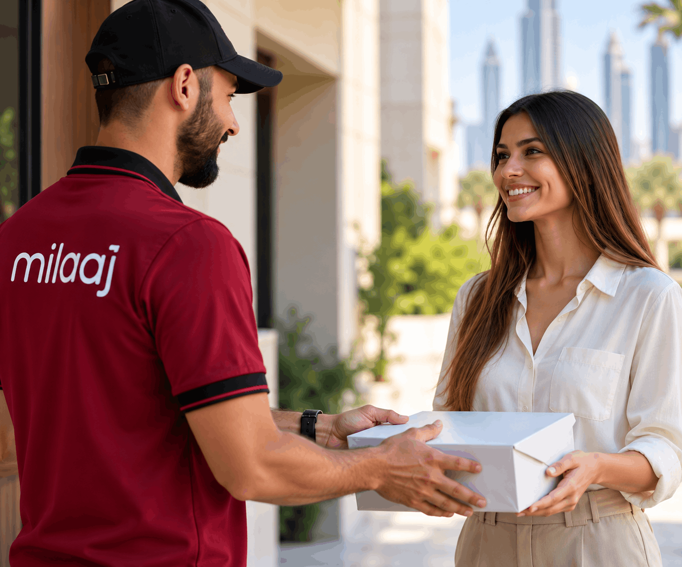 Milaaj courier handing over a free pickup box to a customer in Dubai
